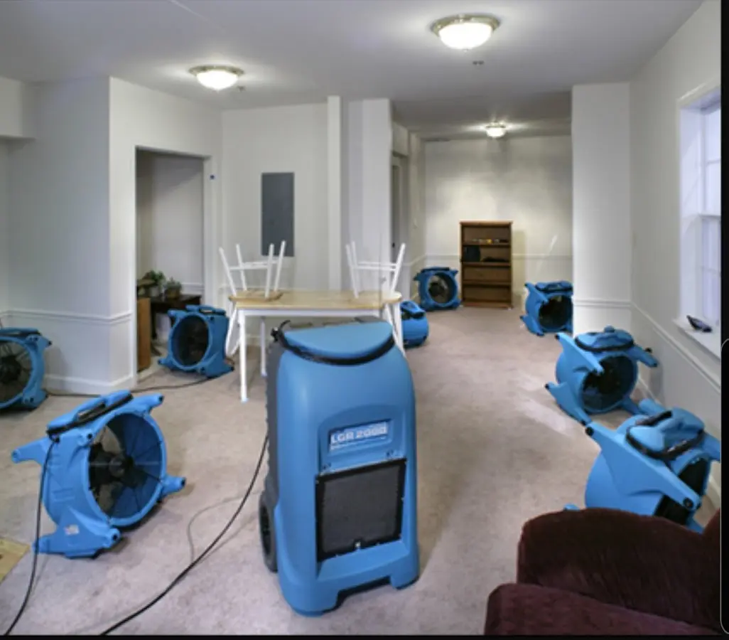 Air movers and dehumidifier setup for Water Damage Restoration in Bedford